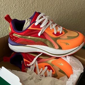 Puma RS-Curve I Am Brave Women's
Sneakers
Color: Neon Citrus-Gold-High Risk Red